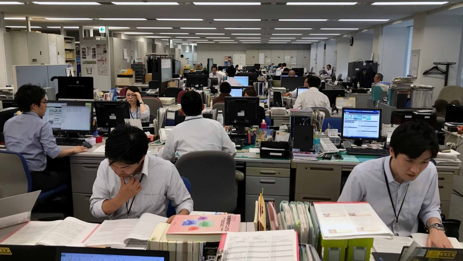 Japanese employees working in the office